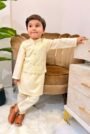 Off white kids kurta suit with textured waistcoat