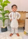 White kids kurta suit with elegant embroidered neckline